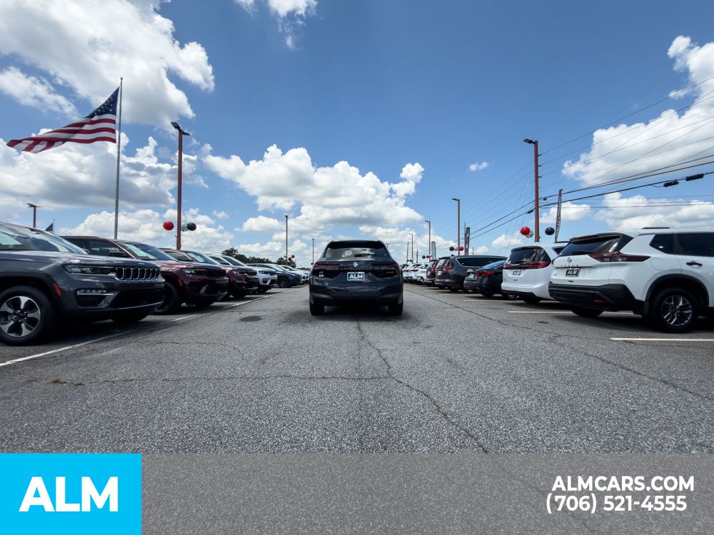 Used 2024 Black BMW xDrive50 image 5