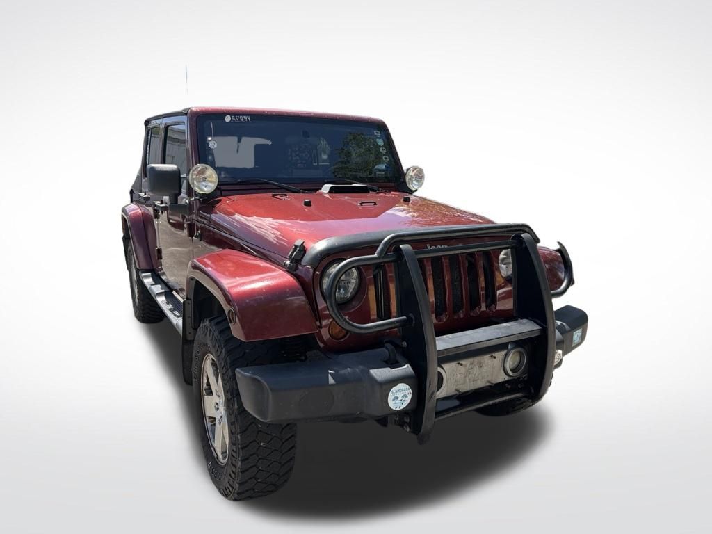 Used 2008 Red Jeep Unlimited Sahara image 2