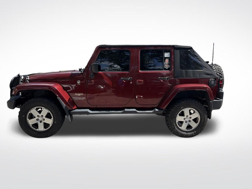 Used 2008 Red Jeep Unlimited Sahara image 8