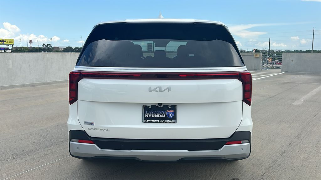 2026 Kia Carnival LXS White at DeMontrond Automotive Group