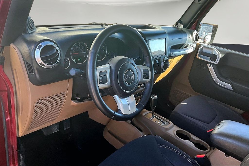 Used 2013 Red Jeep Unlimited Sahara image 17
