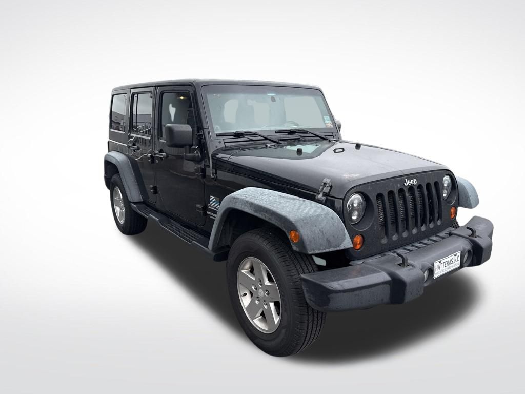 Used 2012 Black Jeep Unlimited Sport image 10