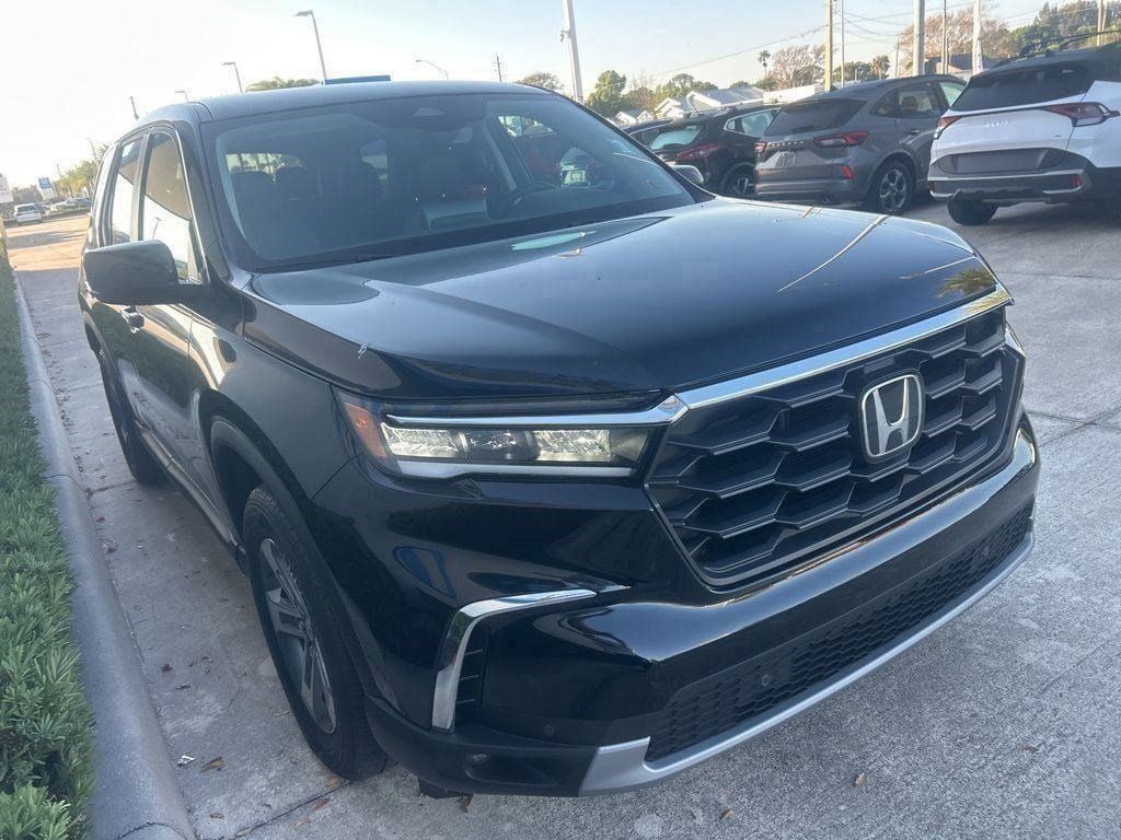 View vehicle photo 3