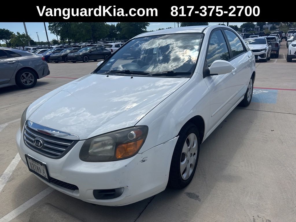 Clear White 2009 Kia Spectra LX Sedan Front-Wheel Drive 4-Speed Automatic Overdrive