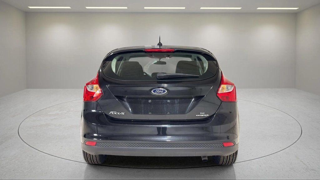 Used 2014 Tuxedo Black Metallic Ford SE image 4