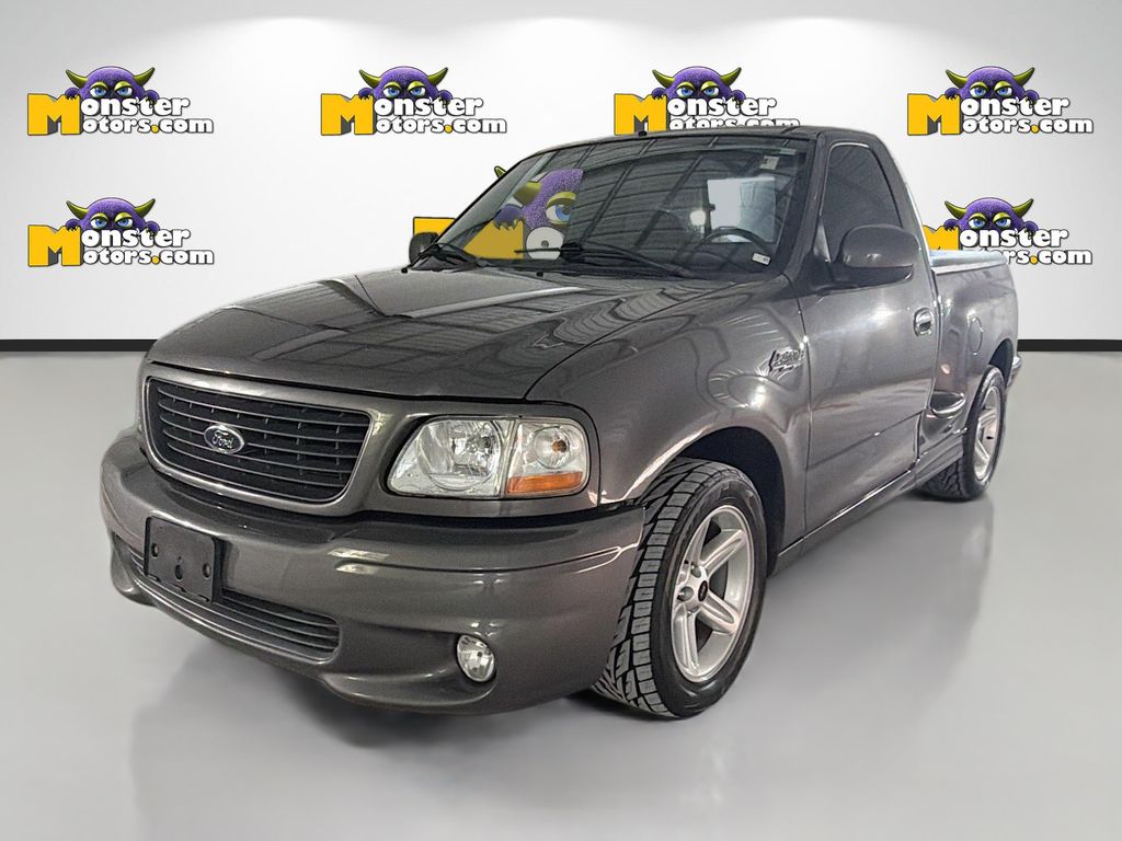 Black (Charcoal) 2004 Ford F-150 SVT Lightning 2 Dr Supercharged Standard Cab Stepside SB Pickup Truck Rear-Wheel Drive 4-Speed Automatic Overdrive