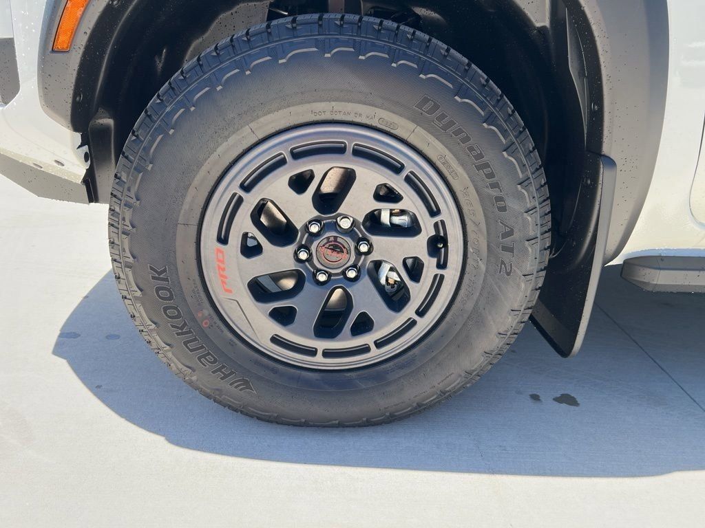 2025 Glacier White Nissan Frontier PRO-4X 4X4 Truck