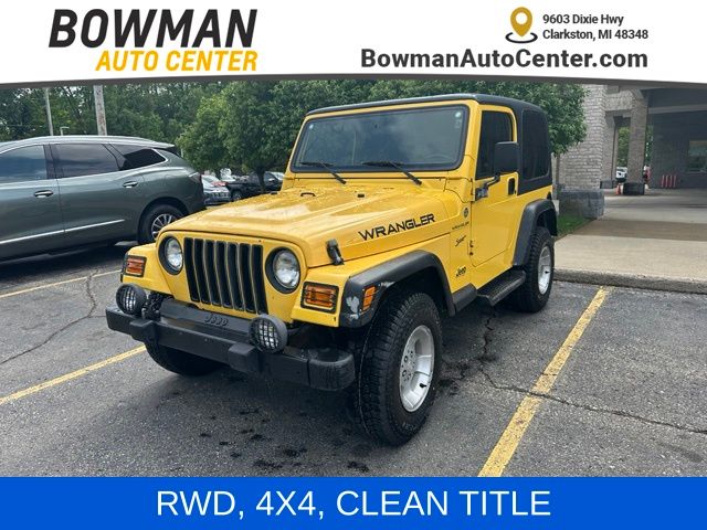 Solar Yellow Clearcoat/Black Soft Top 2002 Jeep Wrangler SUV / Crossover Four-Wheel Drive 3-Speed Automatic