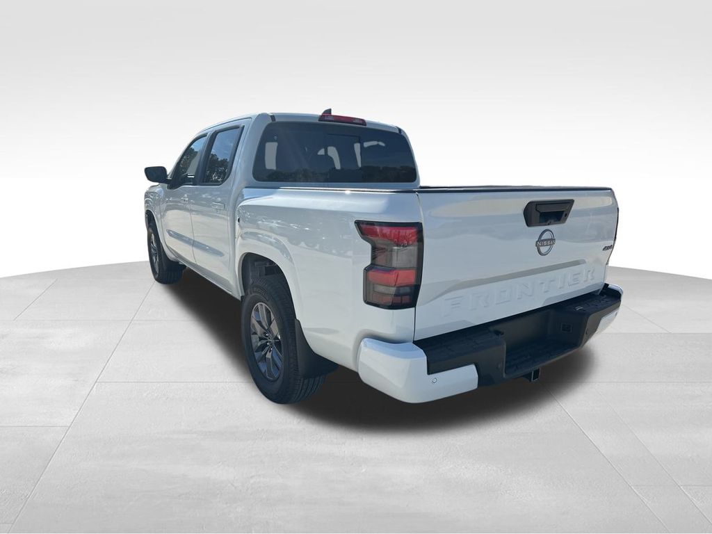 2025 Glacier White Nissan Frontier SV 4X4 Truck