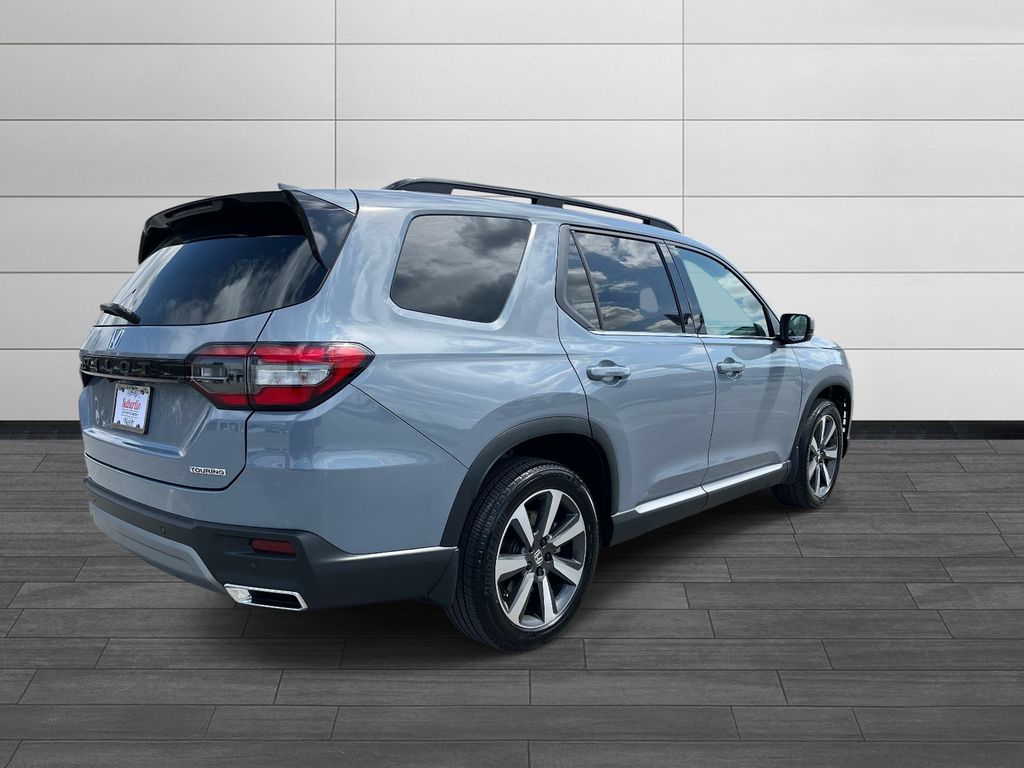 View vehicle photo 3