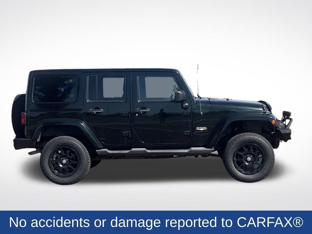 Used 2012 Jeep Wrangler Unlimited Sahara with VIN 1C4BJWEG8CL232007 for sale in Marshall, Minnesota