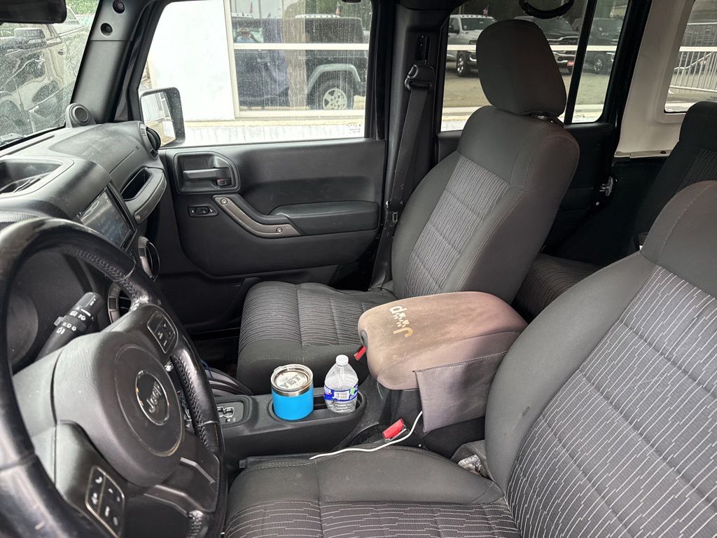 Used 2012 Black Jeep Unlimited Sport image 6