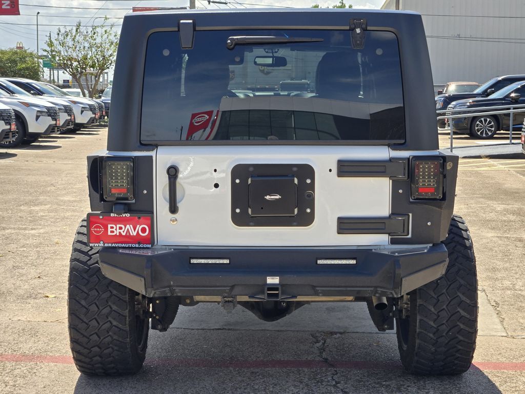 2015 Jeep Wrangler Unlimited Sahara White at DeMontrond Automotive Group