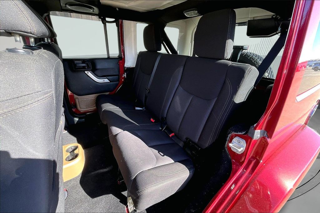 Used 2013 Red Jeep Unlimited Sahara image 21