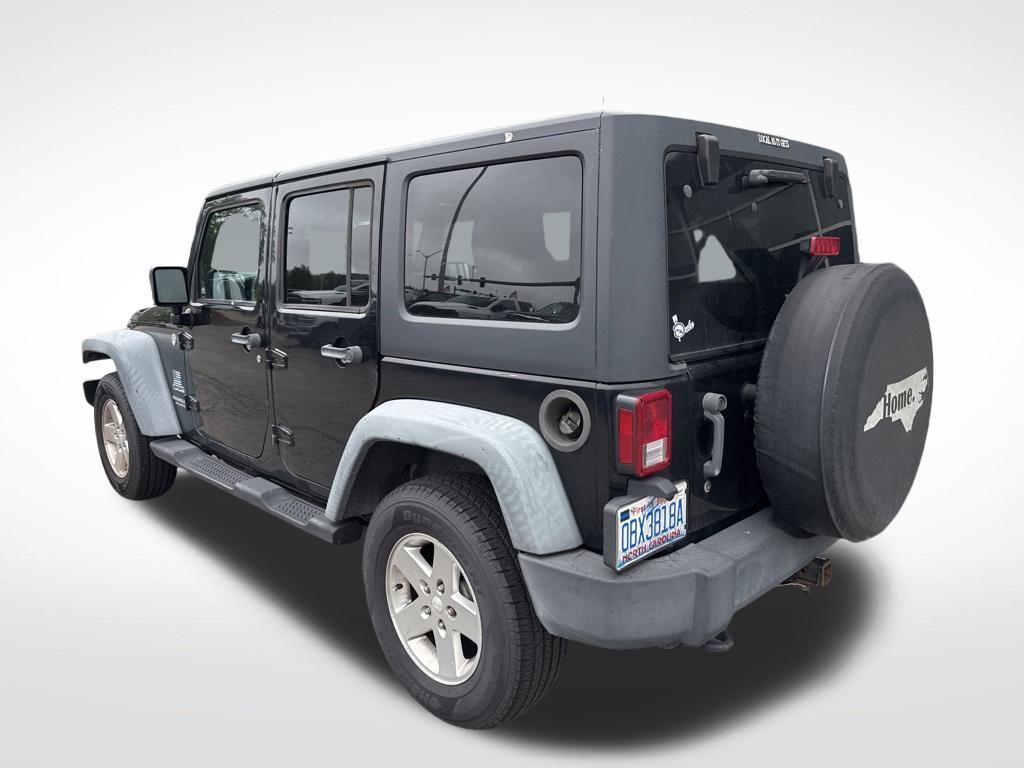 Used 2012 Black Jeep Unlimited Sport image 14