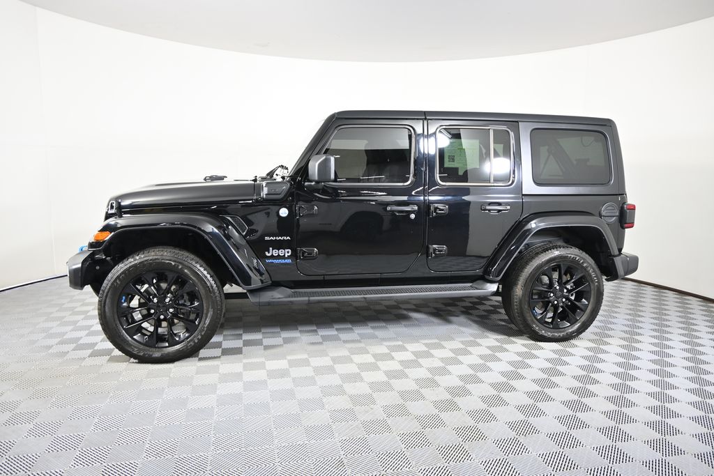 Used 2022 Jeep Wrangler Unlimited Sahara 4XE with VIN 1C4JJXP65NW178141 for sale in Forest Lake, Minnesota