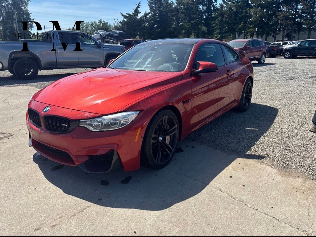 Orange 2015 BMW M4 Coupe RWD Coupe Rear-Wheel Drive 6-Speed Manual