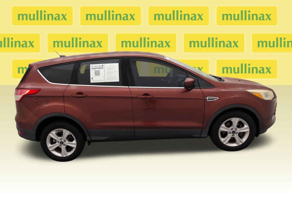 Used 2016 Orange Ford SE image 2