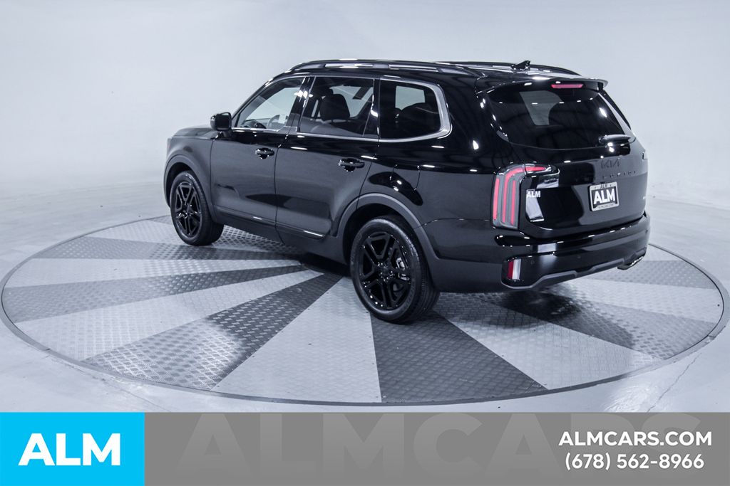 Used 2025 Black Kia EX X-Line image 7