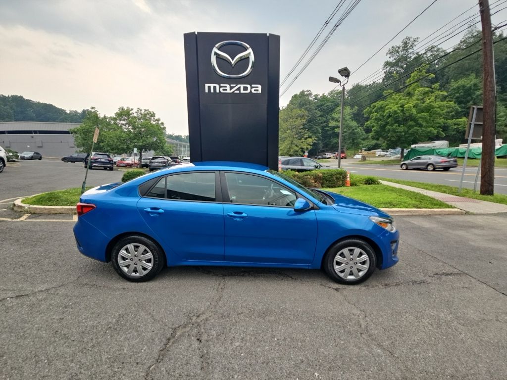 Sporty Blue 2021 Kia Rio Sedan Front-Wheel Drive Continuously Variable Transmission