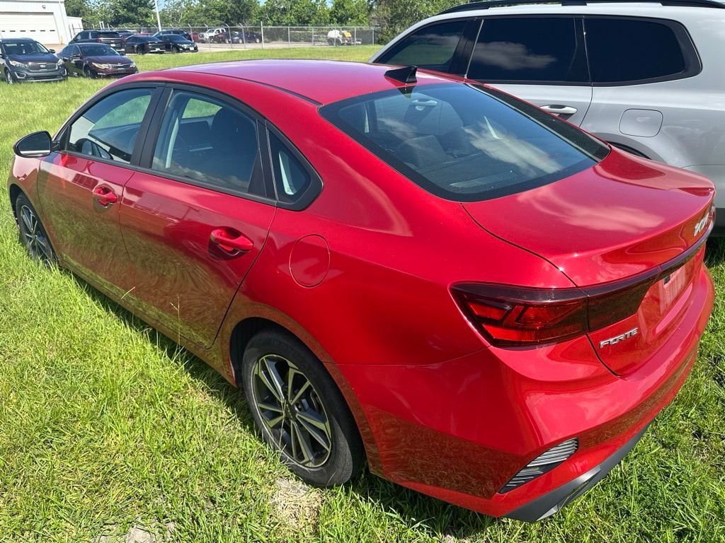 2024 Kia Forte LXS Red at DeMontrond Auto Country