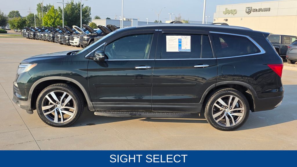 Used 2016 Honda Pilot Touring with VIN 5FNYF6H91GB090682 for sale in Lawrence, KS