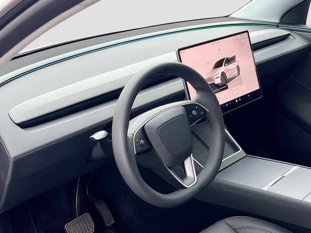 2026 Tesla Model Y Long Range White at AutoSavvy Houston Northwest
