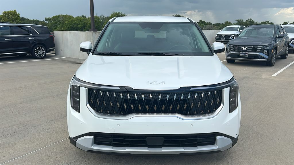 2026 Kia Carnival LXS White at DeMontrond Automotive Group