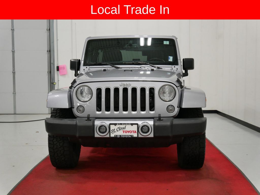 Used 2016 Jeep Wrangler Unlimited Sahara with VIN 1C4BJWEG3GL166651 for sale in Waite Park, Minnesota