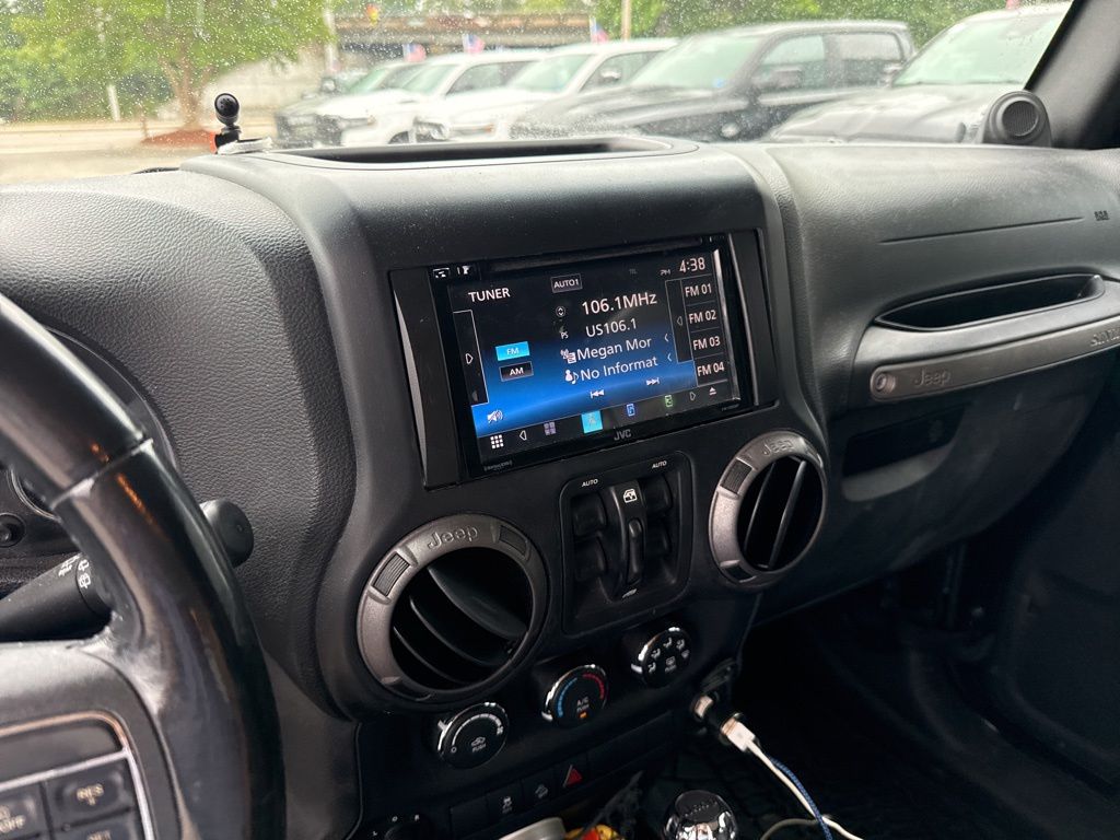 Used 2012 Black Jeep Unlimited Sport image 4