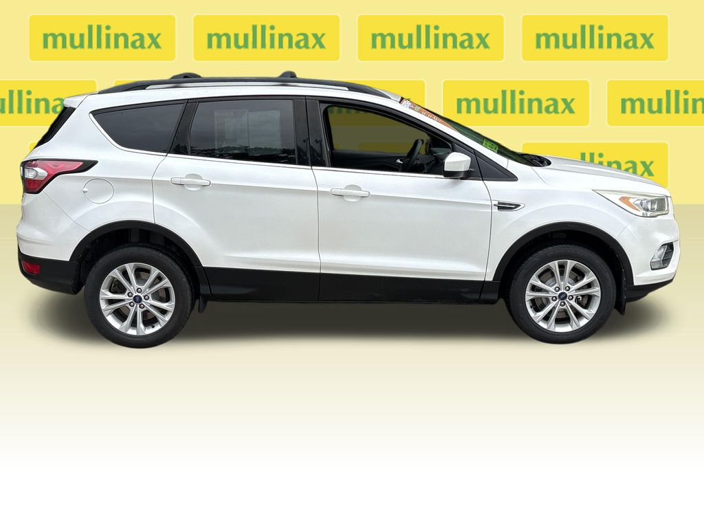 Used 2017 Ford Escape SE with VIN 1FMCU9G96HUC83319 for sale in New Smyrna Beach, FL