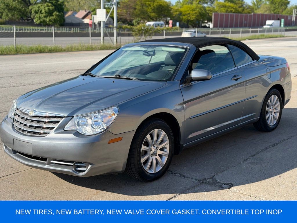 Silver Steel Metallic Clearcoat/Black Vinyl Top 2010 Chrysler Sebring Touring Convertible FWD Convertible Front-Wheel Drive 4-Speed Automatic