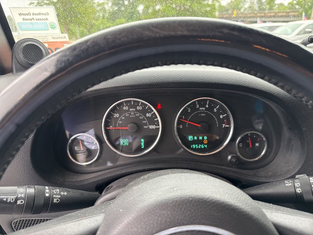 Used 2012 Black Jeep Unlimited Sport image 3