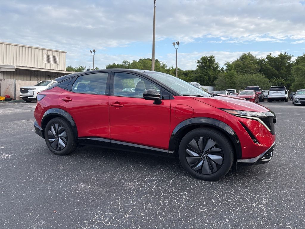 Passion Red Tricoat/Black Diamond Pearl 2024 Nissan Ariya Platinum+ e-4ORCE SUV / Crossover All-Wheel Drive Continuously Variable Transmission