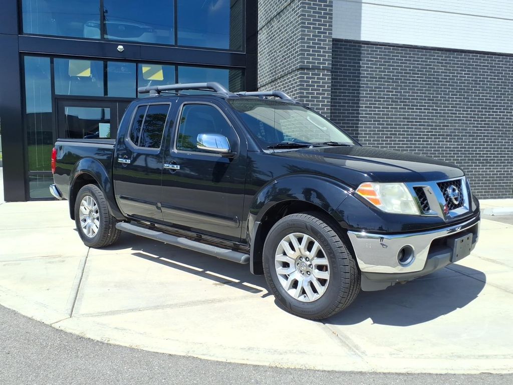 Super Black Metallic 2010 Nissan Frontier LE Crew Cab 4WD Pickup Truck Four-Wheel Drive 5-Speed Automatic Overdrive