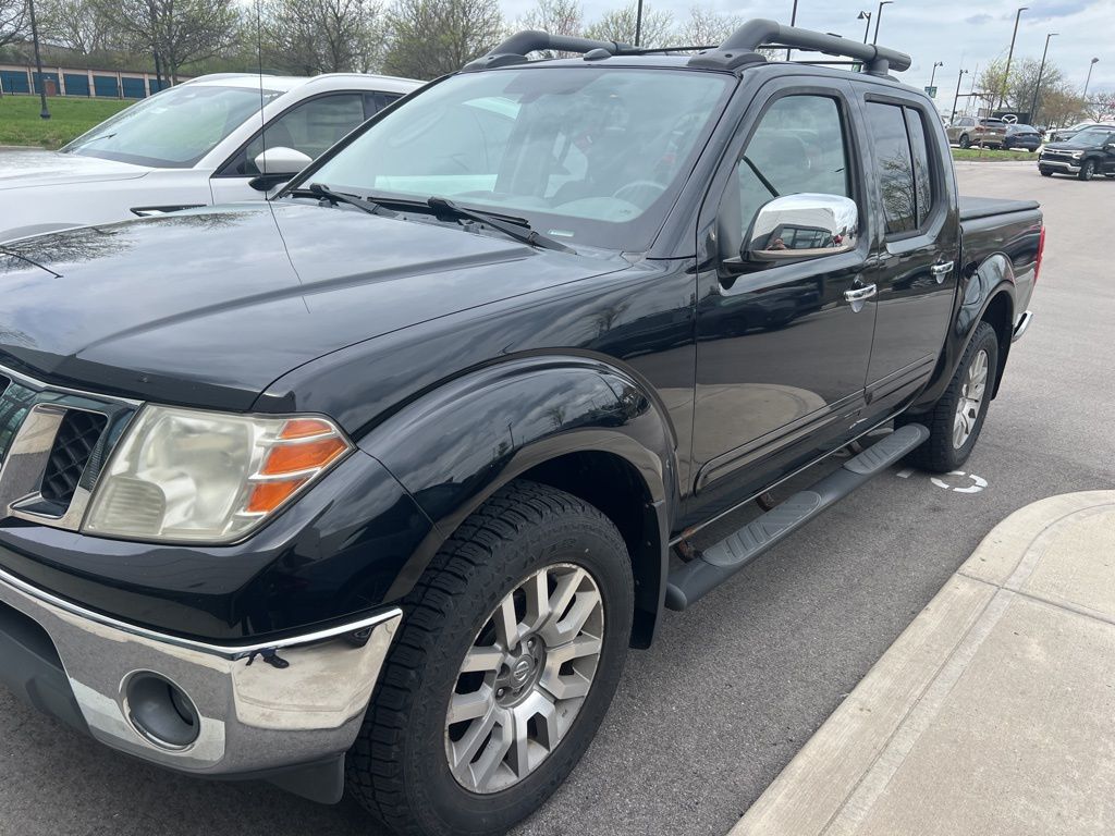 Super Black Metallic 2010 Nissan Frontier LE Crew Cab 4WD Pickup Truck Four-Wheel Drive 5-Speed Automatic Overdrive