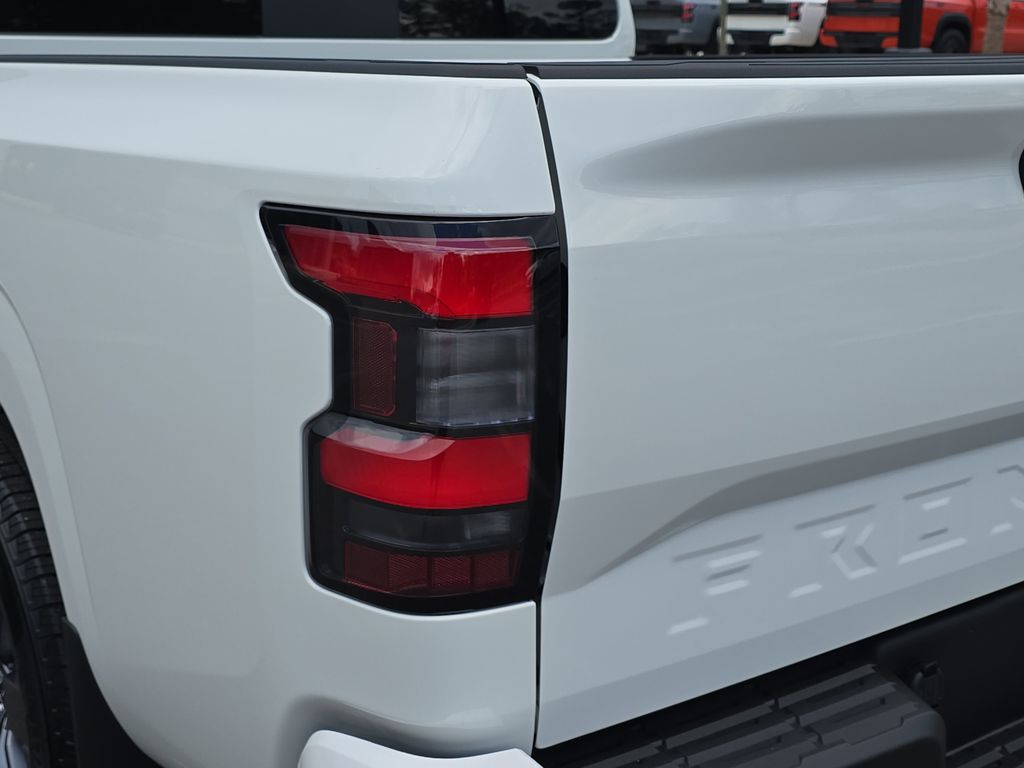 2025 Glacier White Nissan Frontier SV 4X4 Truck