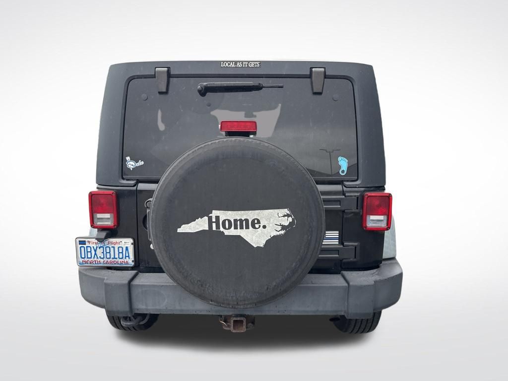 Used 2012 Black Jeep Unlimited Sport image 13