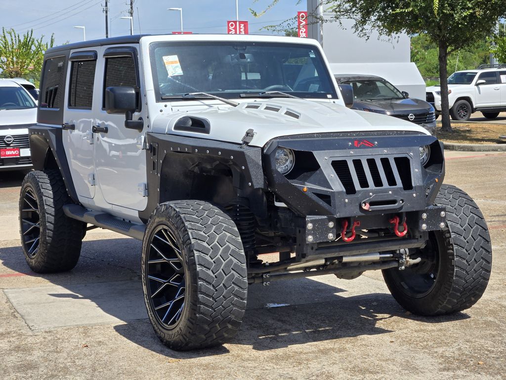 2015 Jeep Wrangler Unlimited Sahara White at DeMontrond Automotive Group