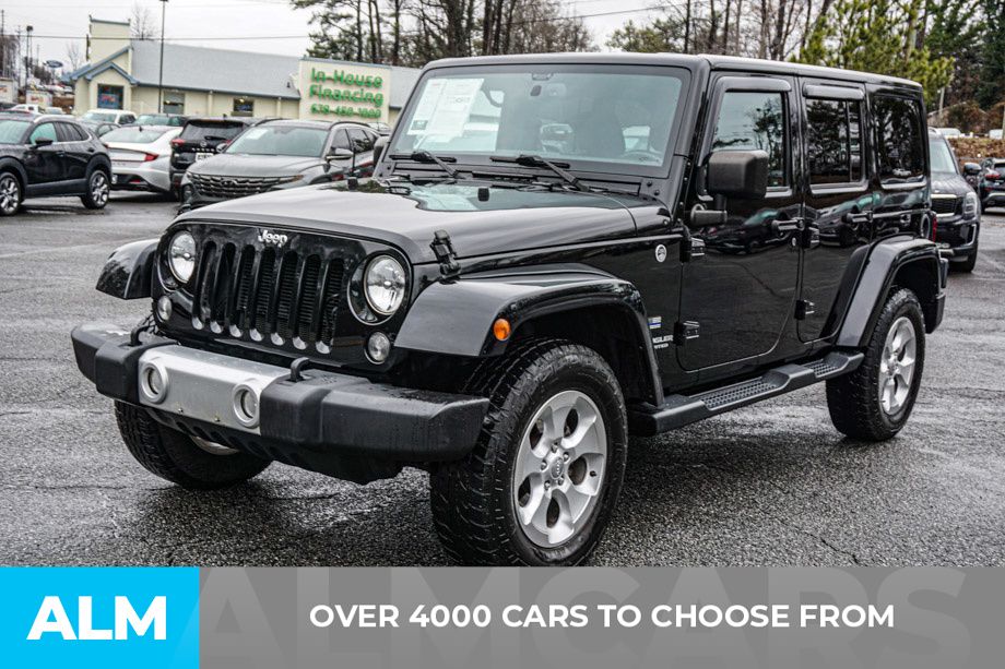 Used 2015 Jeep Wrangler Unlimited Sahara with VIN 1C4HJWEG6FL663752 for sale in Perry, GA