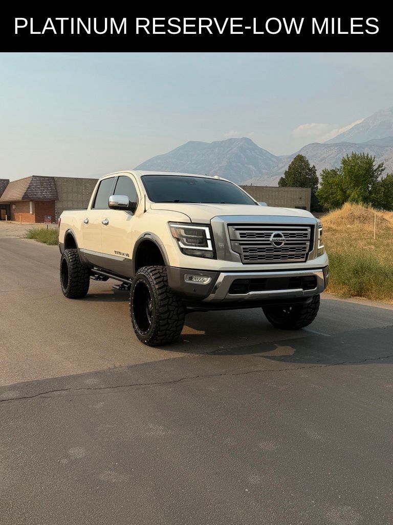 Pearl White Metallic 2021 Nissan Titan Pickup Truck Four-Wheel Drive 9-Speed Automatic