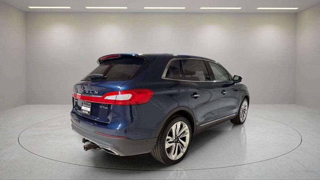 Used 2017 Midnight Sapphire Blue Metallic Lincoln Reserve image 3