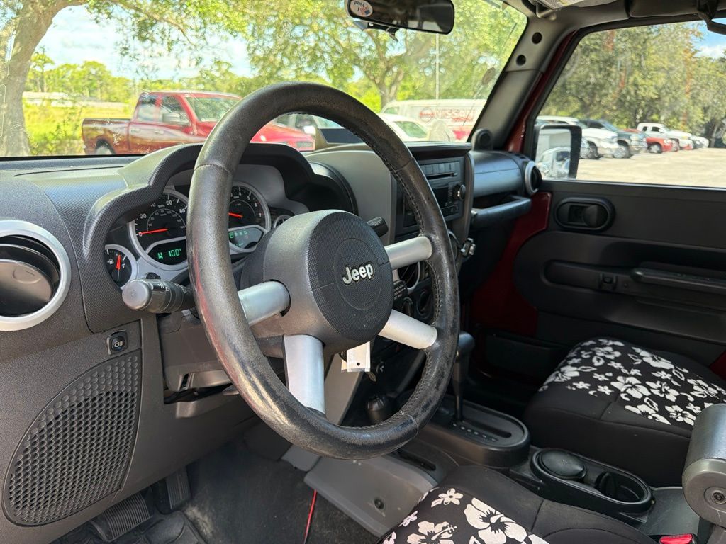 Used 2008 Red Jeep Unlimited Sahara image 9