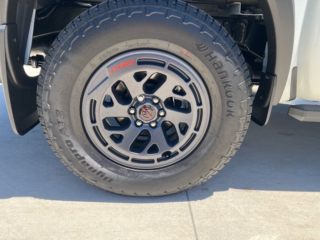 2025 Glacier White Nissan Frontier PRO-4X 4X4 Truck