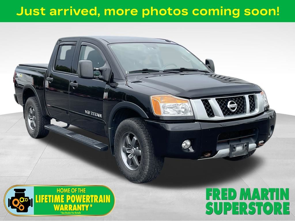 Galaxy Black Metallic 2014 Nissan Titan Pickup Truck Four-Wheel Drive 5-Speed Automatic