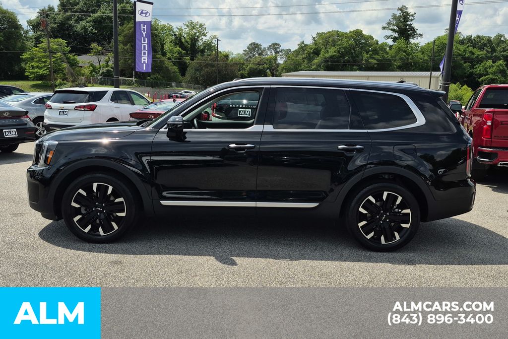 Used 2025 Ebony Black Kia SX-Prestige image 11
