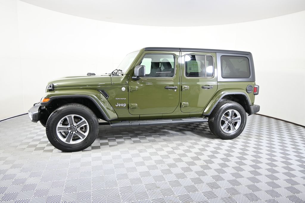 Used 2023 Jeep Wrangler 4-Door Sahara with VIN 1C4HJXENXPW571581 for sale in Forest Lake, Minnesota