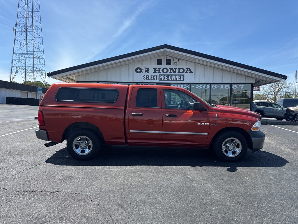 Sunburst Orange Pearlcoat/Mineral Gray Met CC 2009 Dodge RAM 1500 ST Quad Cab RWD Pickup Truck 4X2 5-Speed Automatic
