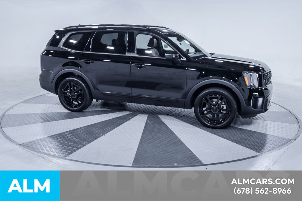 Used 2025 Black Kia EX X-Line image 13