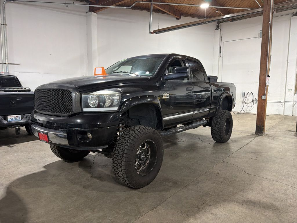 Black 2007 Dodge RAM 3500 Laramie Quad Cab 4WD Pickup Truck Four-Wheel Drive 4-Speed Automatic
